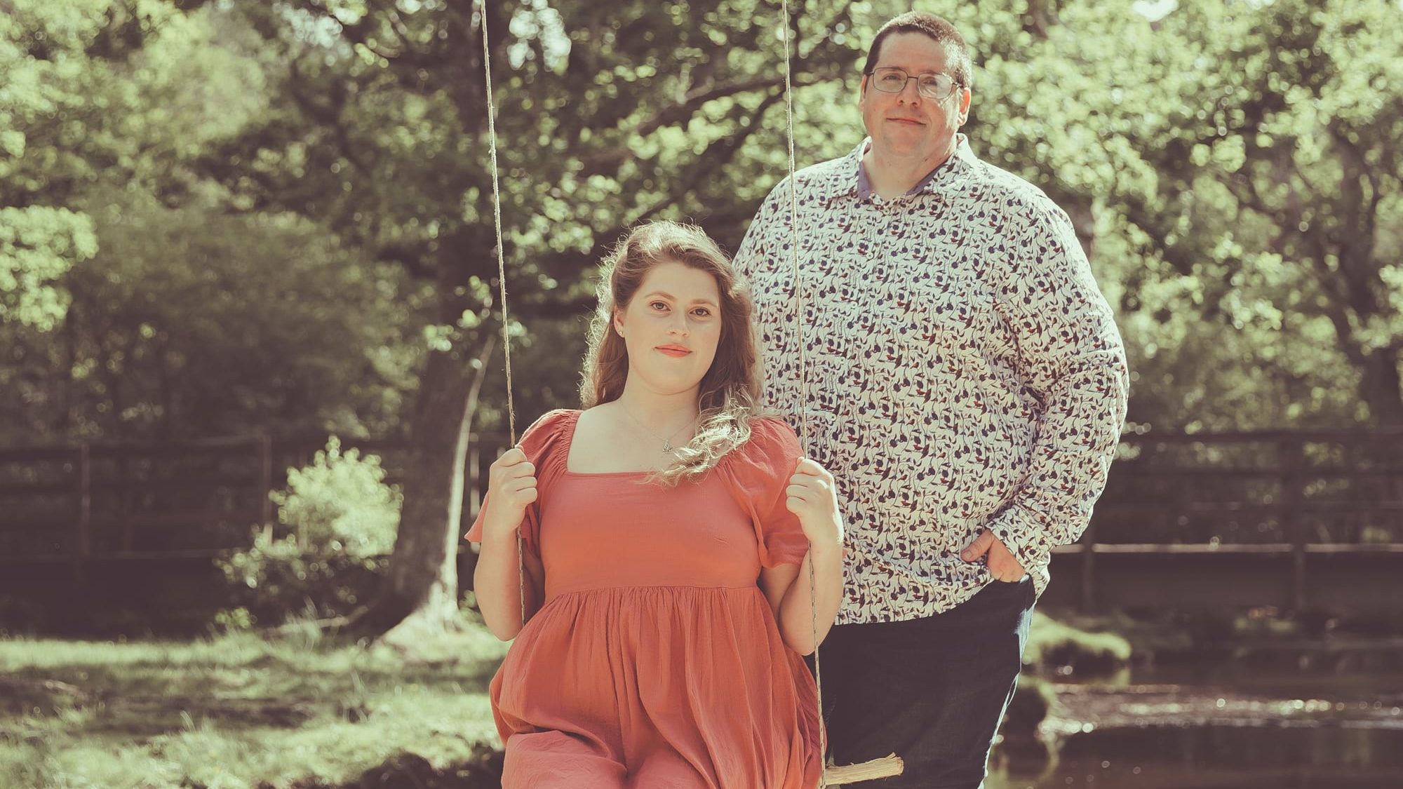 Foxbridge members sitting on a swing - Local Original Singer-Songwriter Folk-Pop Duo from Hampshire